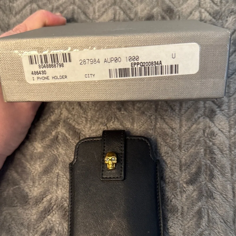 Alexander McQueen Black Phone Holder with Gold Skull Detail
